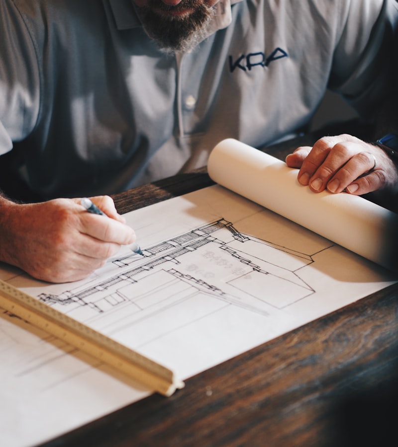 Contractor marking up building plans